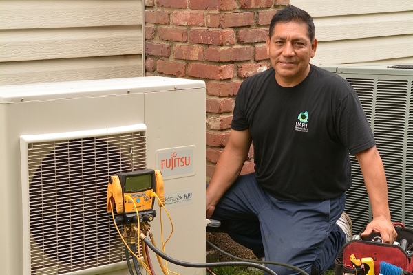 Hart Home Comfort HVAC technician installing ductless air conditioner to a client's house