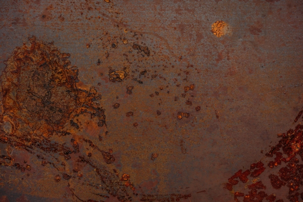 Rusted metal texture depicting fuel oil tank sludge