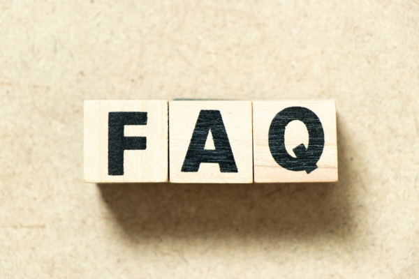 FAQ written using wooden letters depicting HVAC contractor questions