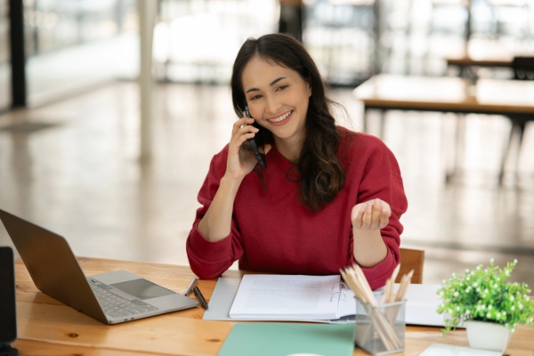 woman on the phone calling for home heating oil delivery