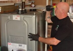 Hart Home Comfort staff tending to Roth Oil Tank