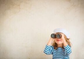 girl looking through the binoculars depicting looking for an HVAC contractor